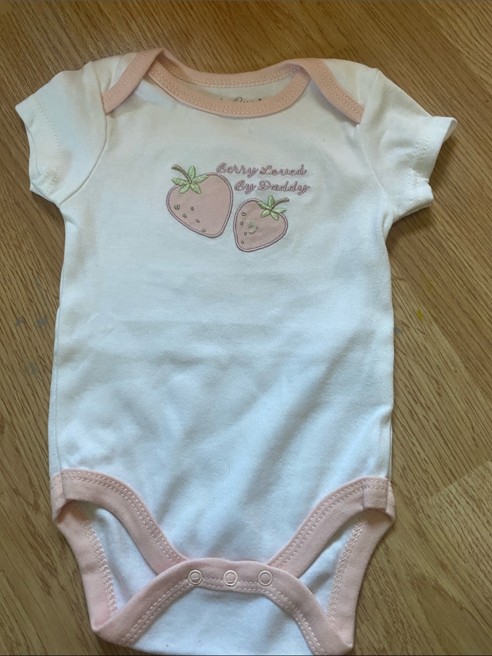 White Baby One-Piece Bodysuit with Pink Trim and Strawberry Motif